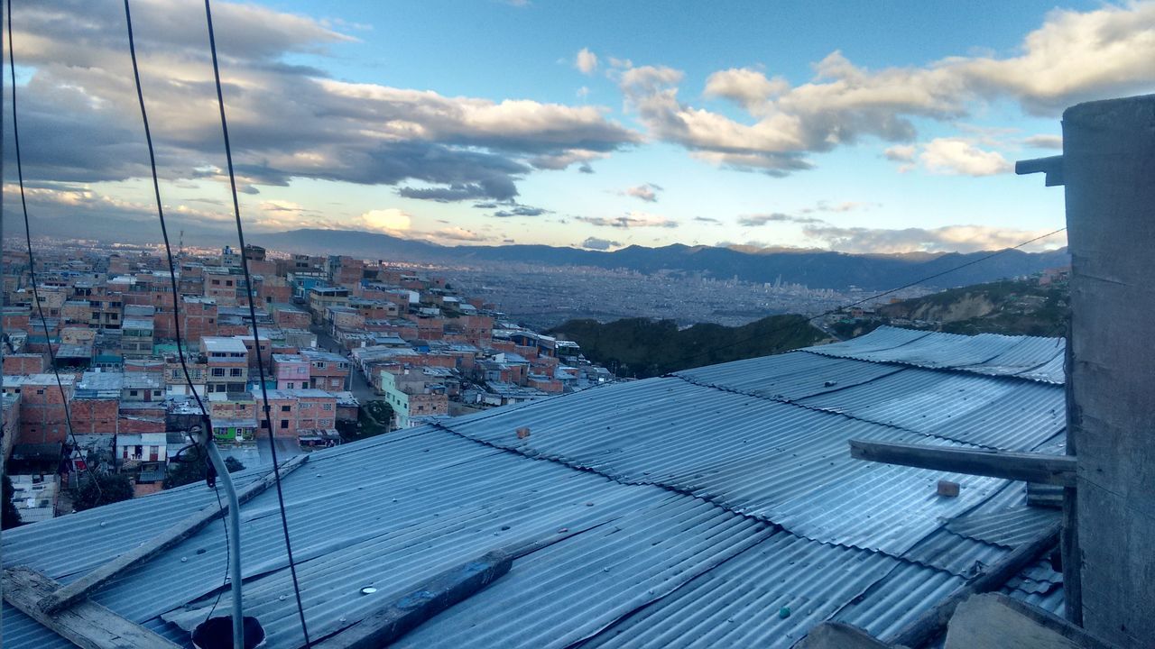 cloud - sky, city, sky, building exterior, built structure, architecture, solar panel, cityscape, no people, outdoors, nature, day, solar power station