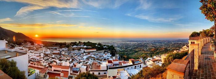 High angle shot of townscape against sky at sunset