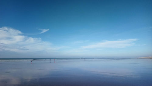 Scenic view of sea against blue sky