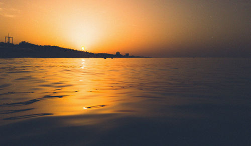 Scenic view of sea against sky at sunset