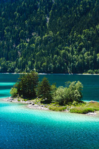 High angle view of sea against mountain