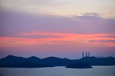 Scenic view of sea against orange sky