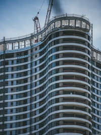 Low angle view of modern building against sky