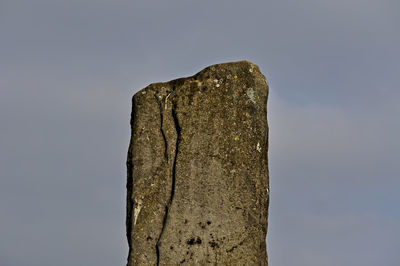 Low angle view of rock formation against sky