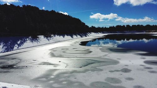 Scenic view of landscape against blue sky