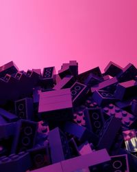 Full frame shot of text against pink background