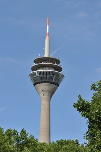 Low angle view of rhine tower against blue sky