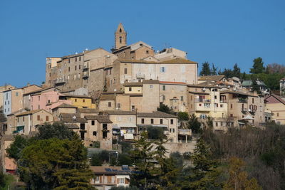 Low angle view of buildings against blue sky