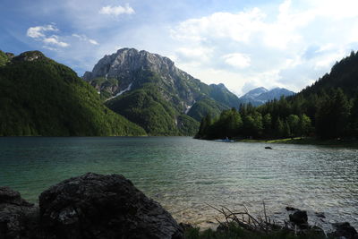 Scenic view of lake and mountains against sky