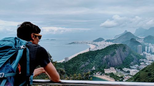 Rear view of man looking at mountains