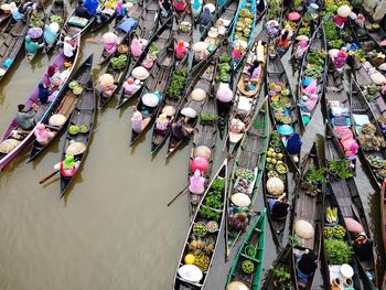 High angle view of people for sale at market stall