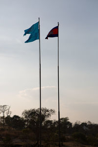 Low angle view of flag against sky