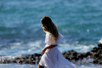 Woman standing on beach