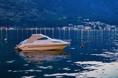 Sailboats moored on sea