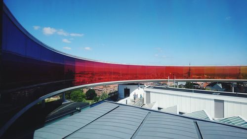 View of modern building against blue sky
