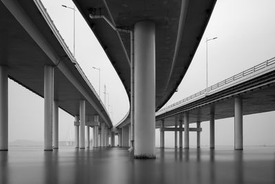 Modern bridge intersection over the sea, long exposure