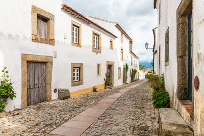 Footpath amidst buildings in town