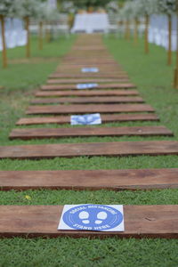 Information sign on grassy field in park