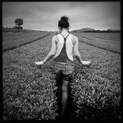 Woman standing on field