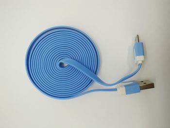 Directly above shot of usb cable on white background