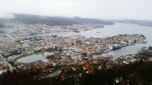 Aerial view of illuminated city against sky