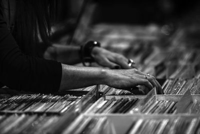 Close-up of hand choosing records at store