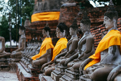 Many old buddha statues in the ancient city of ayutthaya, thailand.