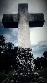 Low angle view of cemetery against sky