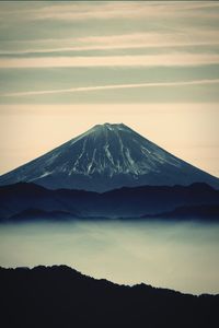 Scenic view of silhouette mountains against sky