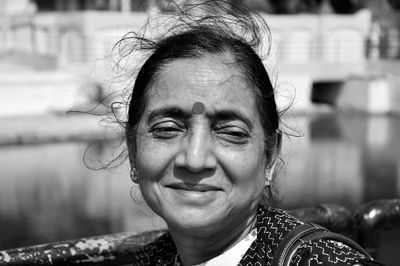 Close-up of smiling woman looking away 