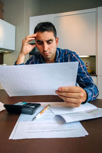 Mid adult man using smart phone