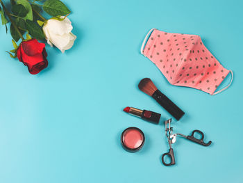 High angle view of red flower on table