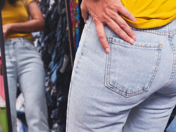 Rear view of people standing outdoors