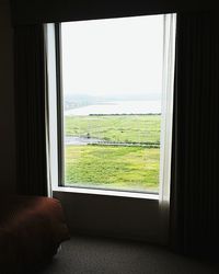 View of landscape seen through window