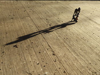 High angle view of shadow on wood
