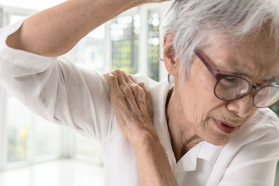 Cropped image of senior woman holding hands