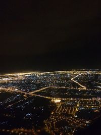 Aerial view of cityscape at night