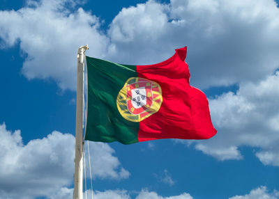 Low angle view of flag against sky