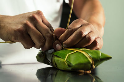 Close-up of man hand on table