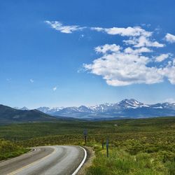 Scenic view of landscape against blue sky