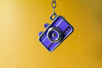 Directly above shot of telephone pole against yellow background