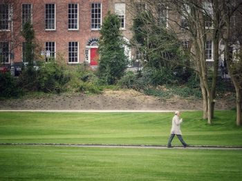 Side view of man walking in park