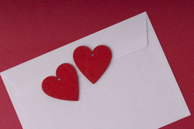 High angle view of heart shape on red paper