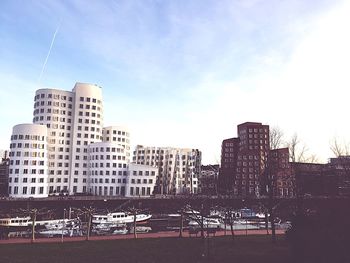 Buildings in city against sky