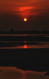 Scenic view of sea against romantic sky at sunset