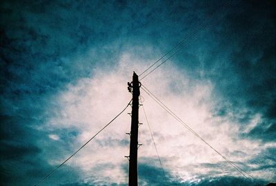 Low angle view of power lines against sky