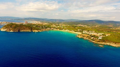 Aerial view of sea and landscape against sky