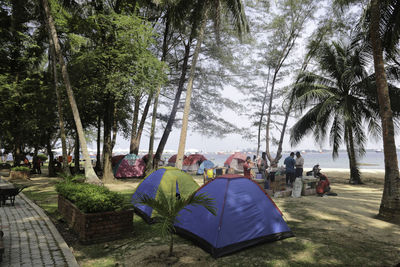 Panoramic view of people in park against sky