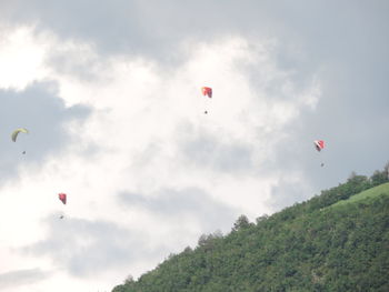 Low angle view of kite flying against sky