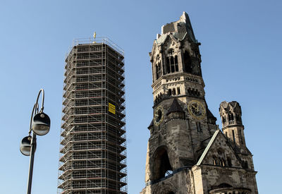 Low angle view of kaiser wilhelm memorial church against clear sky in city